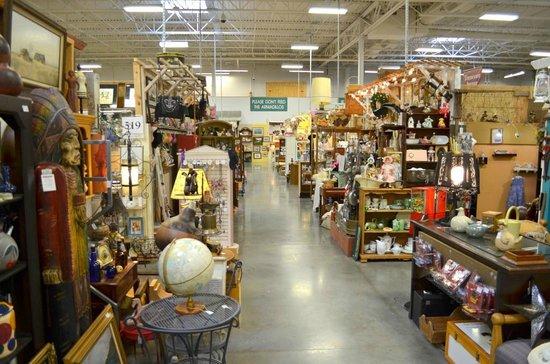 Wide interior view of St Charles Antique Mall showing multiple vendor booths filled with antiques and collectibles