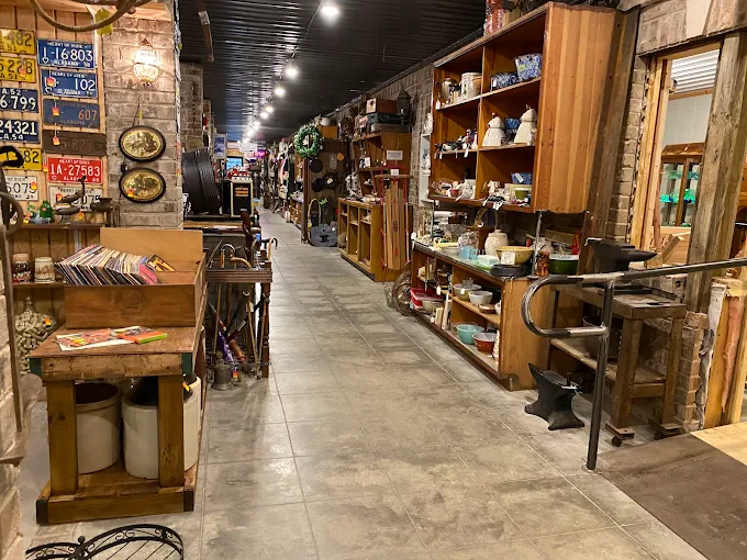 Indoor flea market aisle with vintage items and antiques inside Highway Pickers Antique Mall in Cullman Alabama