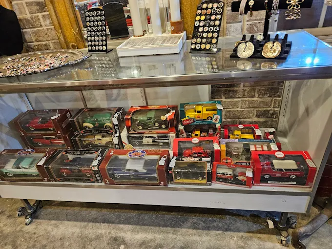 Vintage toy trucks and collectible display case at Highway Pickers Antique Mall in Cullman Alabama
