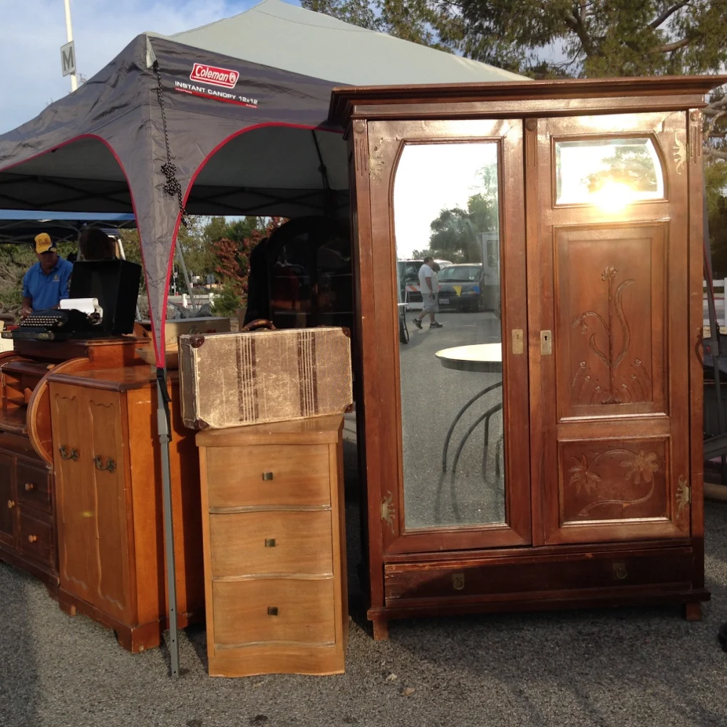 Mid-century modern and antique furniture on display at Topanga Vintage Market in Woodland Hills, Los Angeles — teak tables, vintage chairs, and rustic décor.