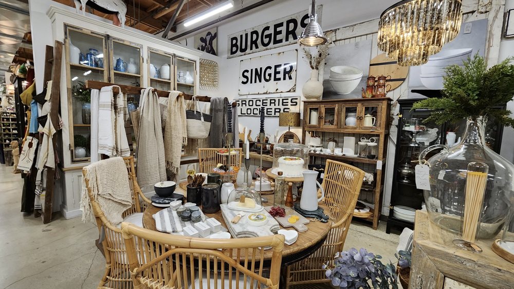 Vendor booths and vintage displays inside The Agoura Antique Mart in Agoura Hills, featuring antiques, décor, and collectibles.