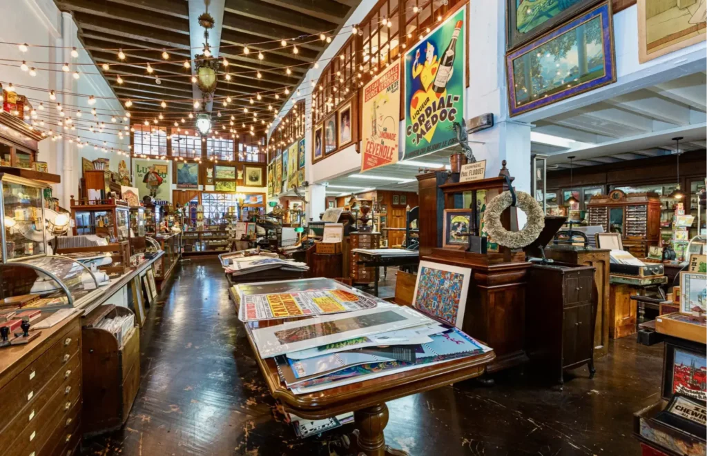 Interior of The Box SF in San Francisco showing vintage ephemera, printing presses, and antique general store displays