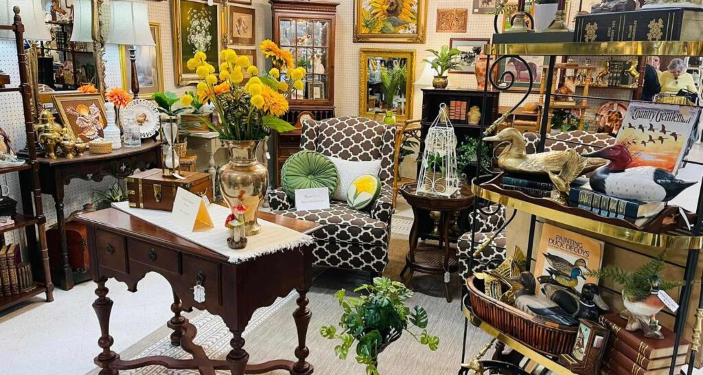 Elegant vintage living room setup with mid-century furniture and decorative mirrors.