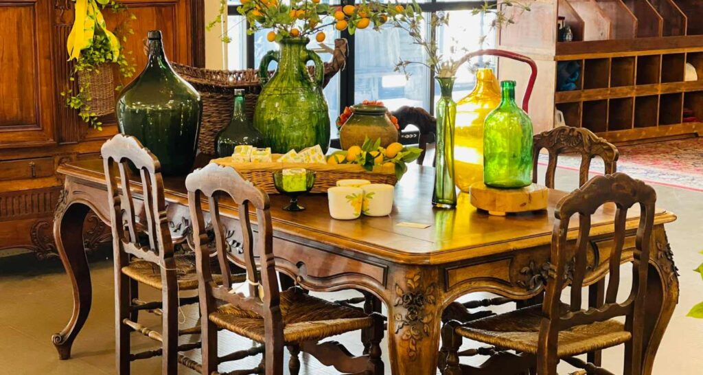 Antique wooden furniture display inside a Tennessee antique mall, featuring vintage tables and cabinets.