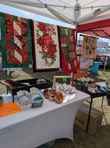 Rutledge Flea Market vendor tent selling handmade quilts and crafts in Rutledge Missouri outdoor flea market