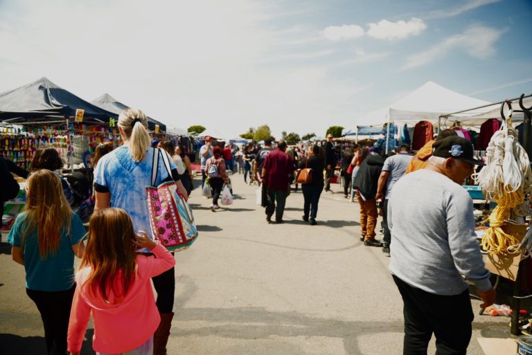Maclin Open Air Market entrance in Ontario, California with outdoor vendor stalls and weekend shoppers