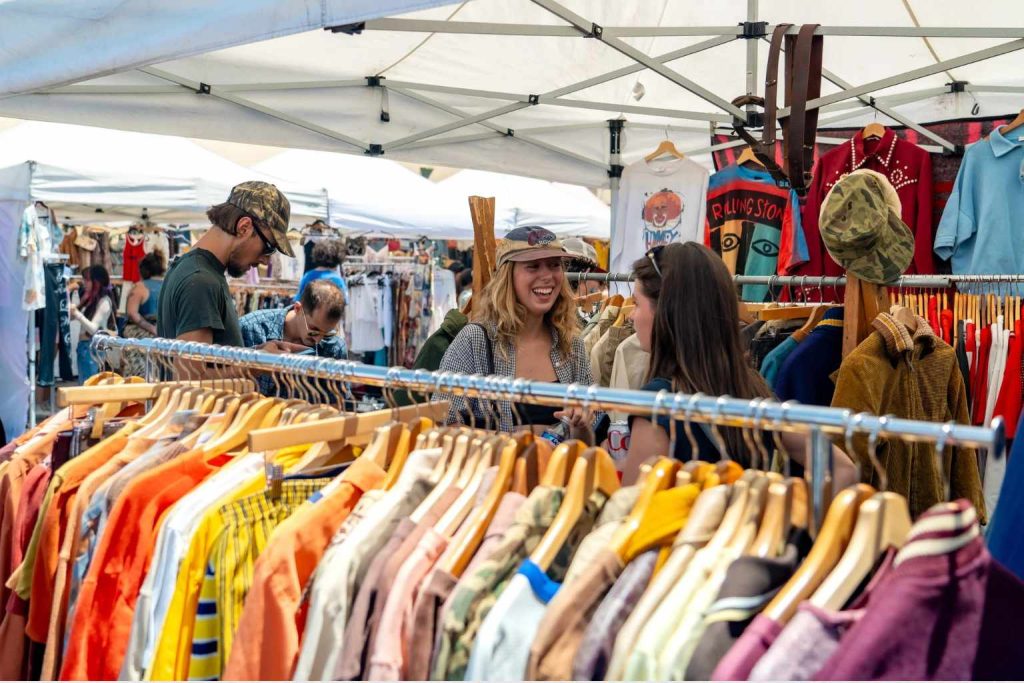 Wide view of vendor tents and shoppers walking through Silverlake Flea outdoor market
