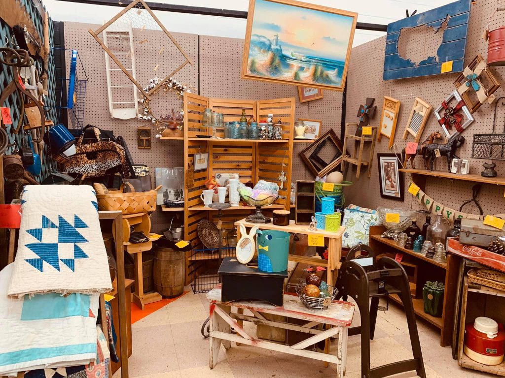 Mid-century modern furniture and antique wooden décor displayed inside an Ohio antique mall