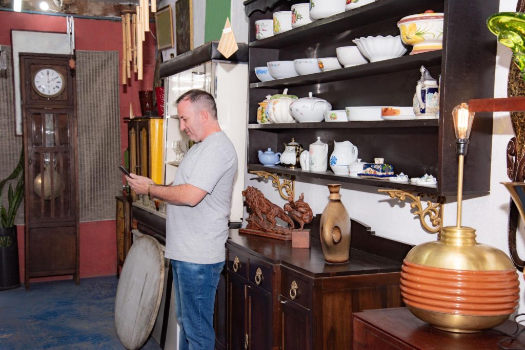 Visitors browsing antiques and collectibles inside an Ohio antique mall and flea market