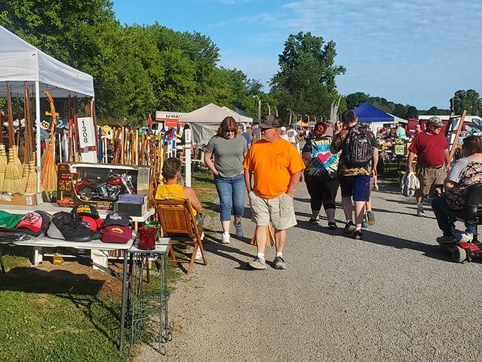 Outdoor flea market in Ohio with vendor tents selling antiques, collectibles, and secondhand goods