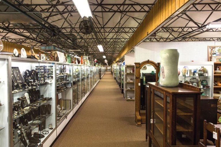 Interior of large antique mall in Springfield Ohio with vintage furniture glassware and collectibles