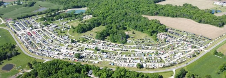 Aerial view of the 85-acre Rutledge Flea Market in Rutledge, Missouri, showing vendor rows, parking areas, and open fields on market weekend.”