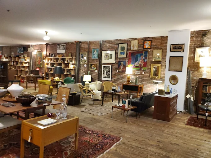 Inside Portland Flea-for-All showcasing vintage furniture, antiques, and rotating vendor booths in Portland, Maine